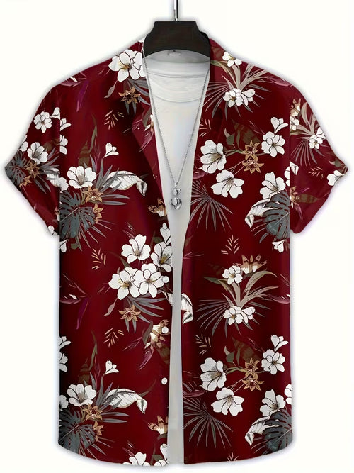 A short-sleeve button-up camp shirt with a red base and a white, gray, and brown tropical floral print, displayed on a hanger over a white t-shirt.