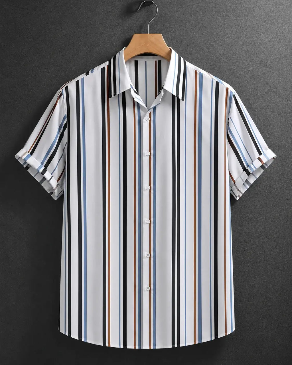 A short-sleeve button-up shirt with vertical stripes in black, white, blue, and brown, hanging on a wooden hanger against a dark gray textured background.