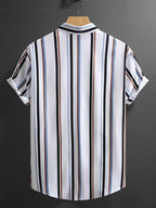 Striped shirt on a hanger against a dark background