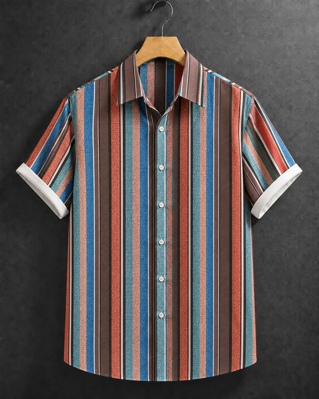 A short-sleeve button-up shirt with vertical stripes in blue, red, brown, and beige, hanging on a wooden hanger against a dark textured background.