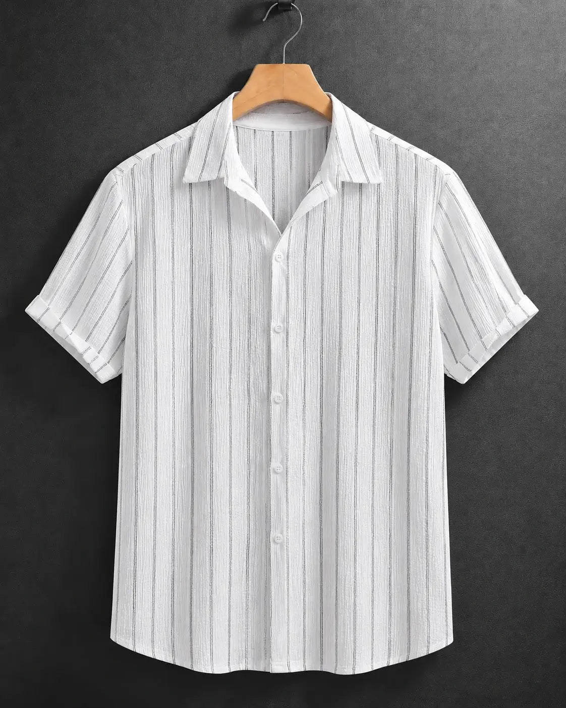A white short-sleeve button-up shirt with thin vertical gray stripes, hanging on a wooden hanger against a dark gray textured background.