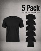 A black short-sleeve crew-neck t-shirt is shown prominently on a textured gray background, with a large text overlay reading '5 Pack ON SALE NOW' and five smaller duplicate views of the shirt arranged vertically on the right.