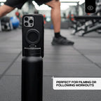 Black phone case with a water bottle holder on a gym floor.