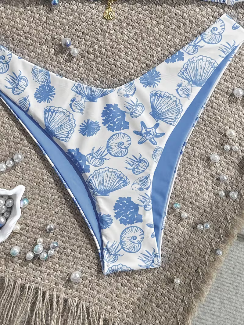 Bikini bottom with blue shell pattern on a textured surface