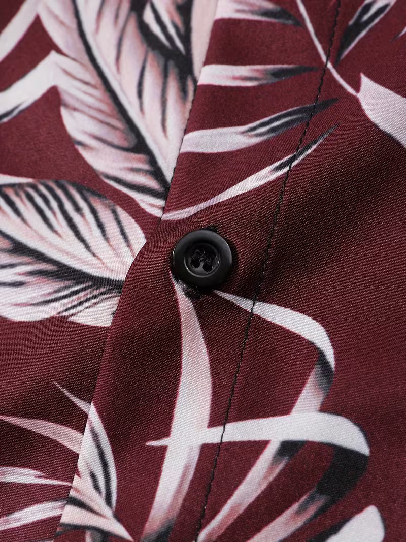 Close-up of a button on a shirt with leaf pattern